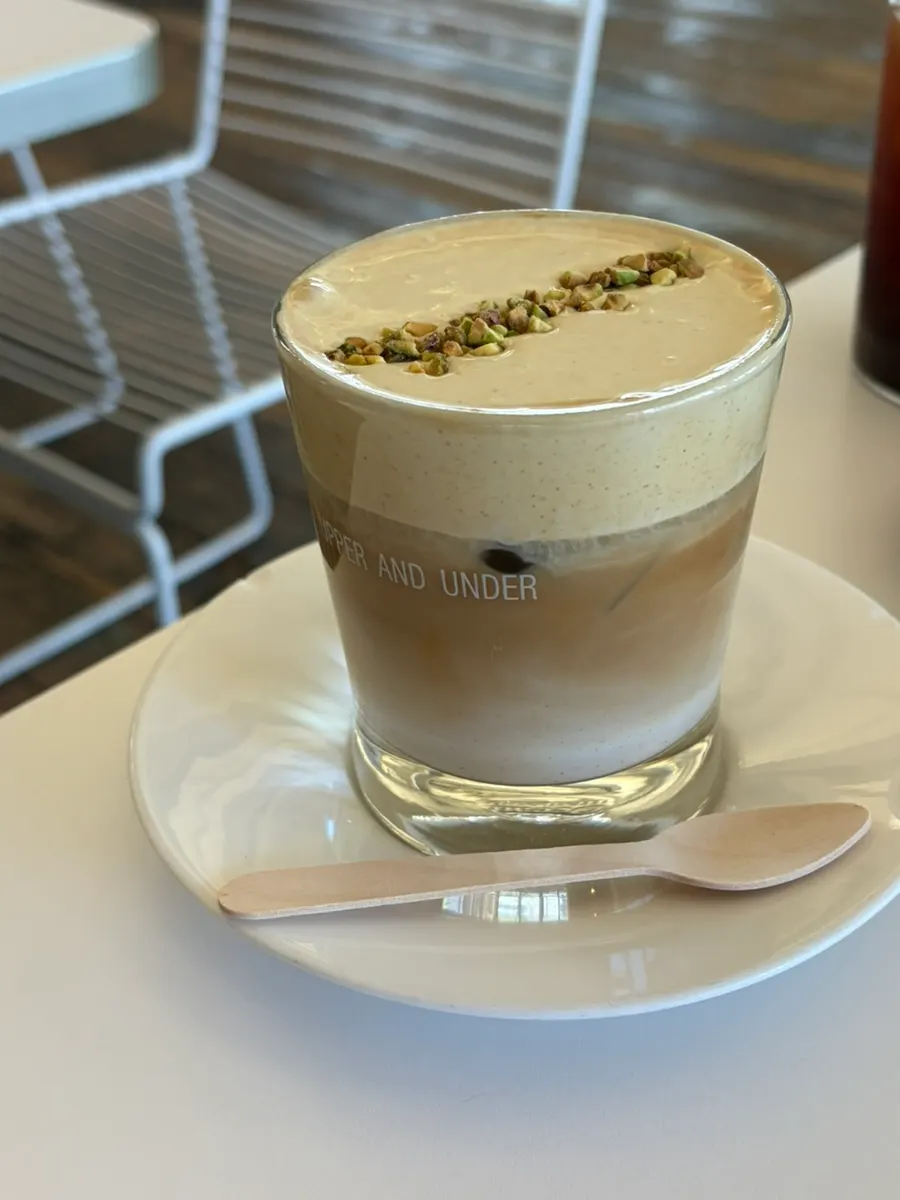 Iced americano, pistachio cream latte, and two desserts