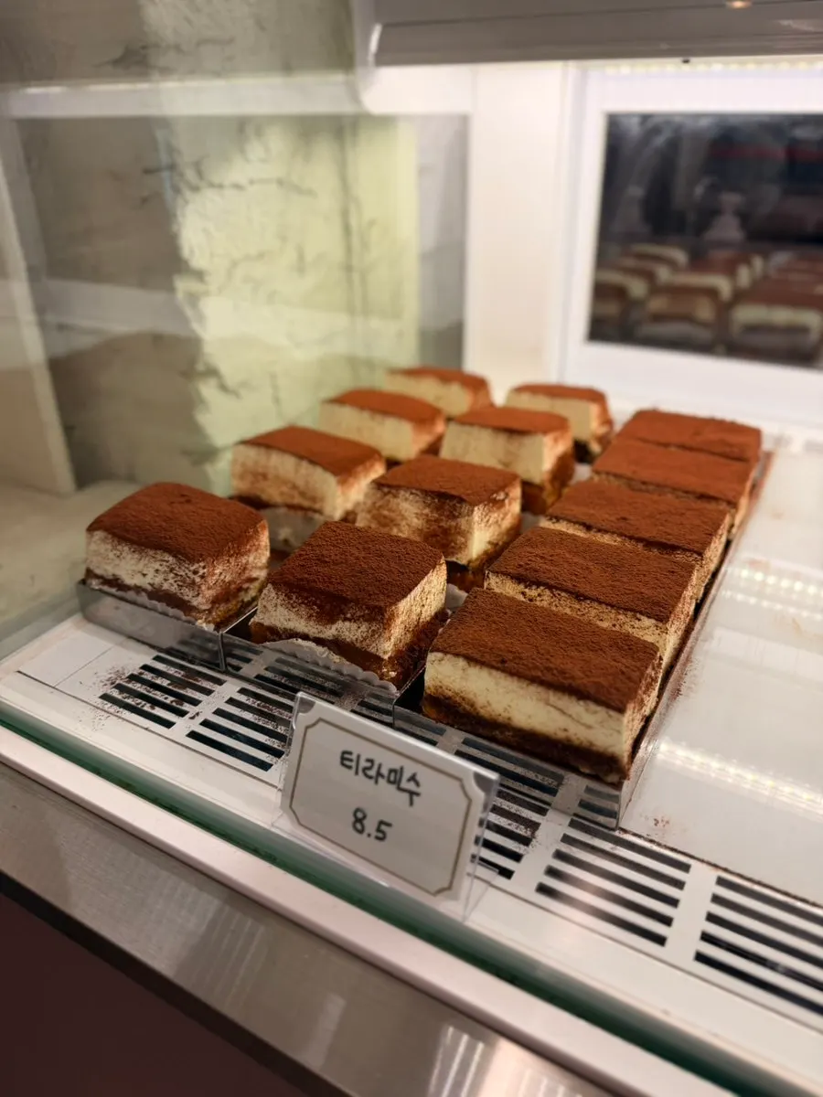 Showcase with yellow cheese Basque cheesecake