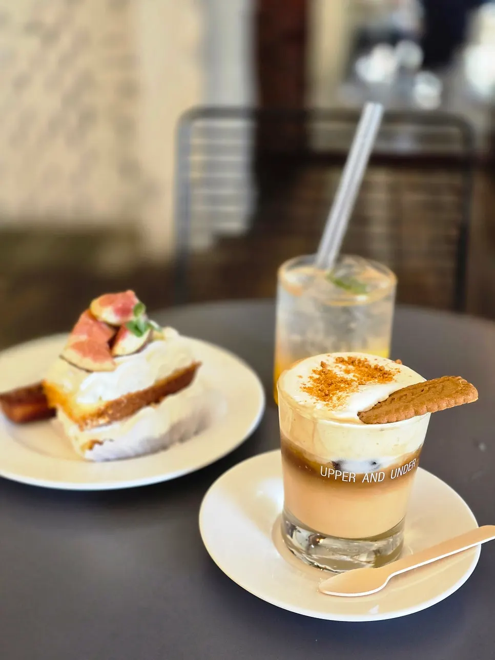 Cake, financier, ade, and cream coffee laid out on the table