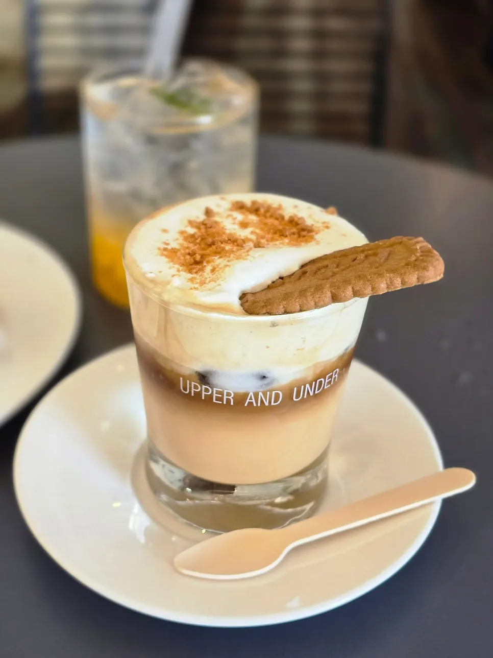 Two glasses: mango lemon ade and salted caramel cream coffee