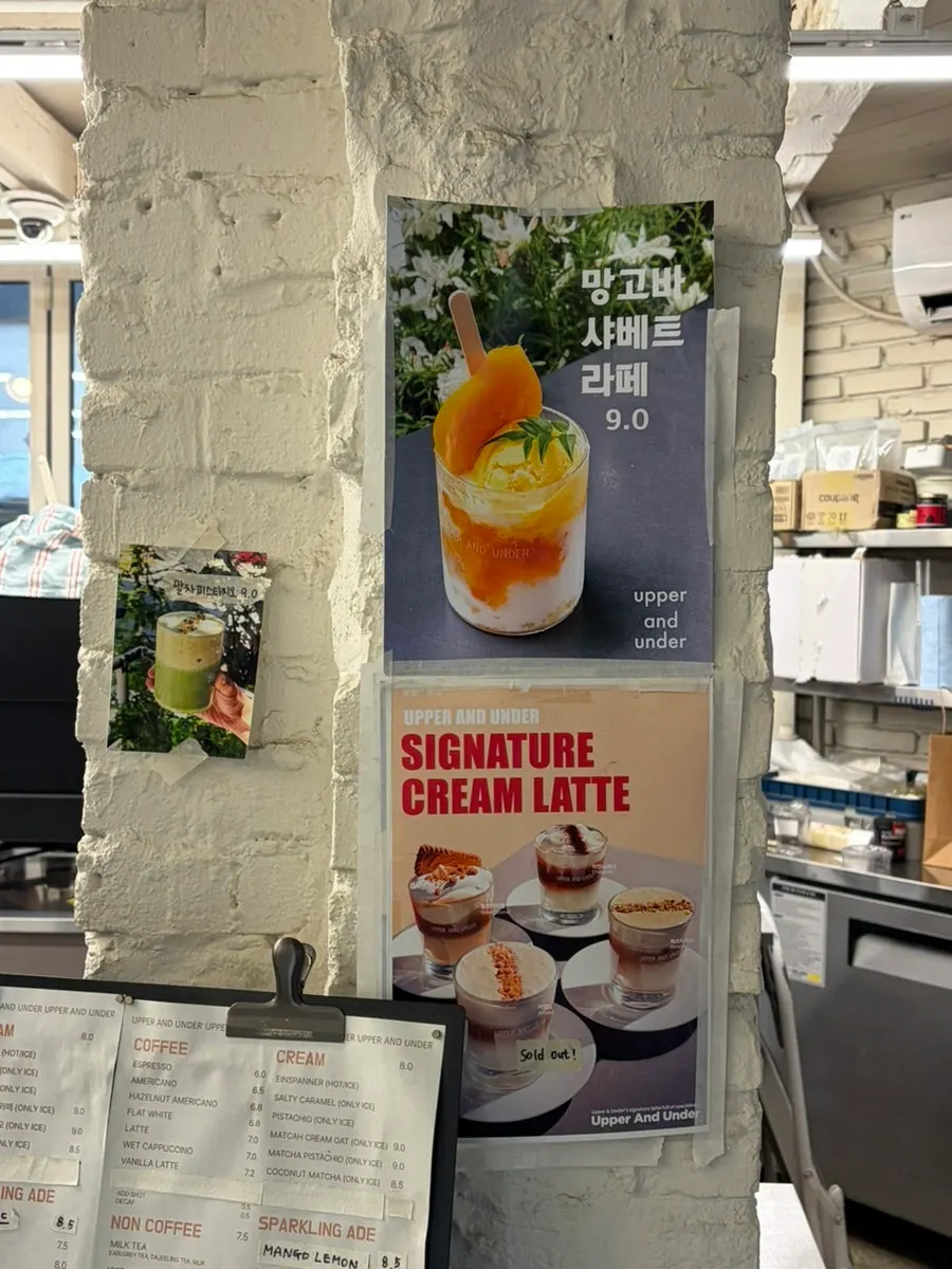 Signature drink menu display at Upper and Under