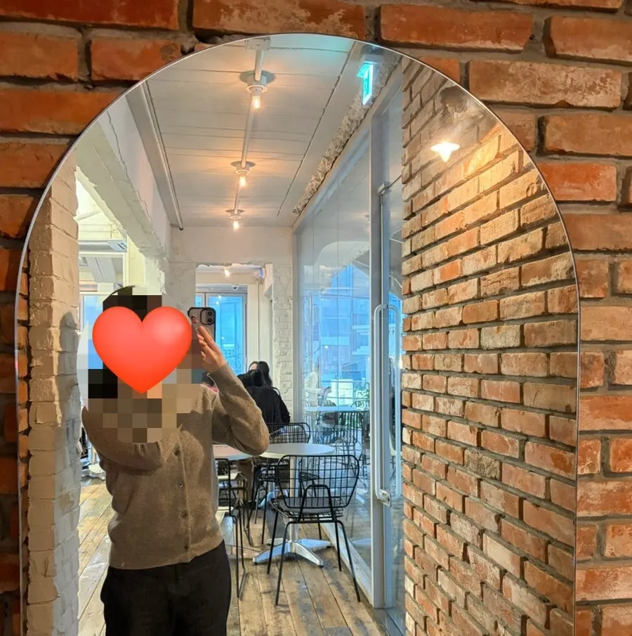 Full-length mirror photo zone at Upper and Under