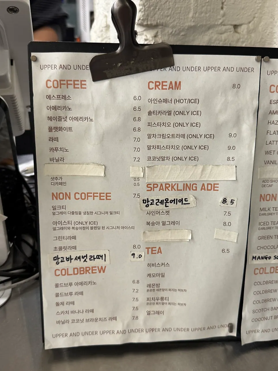 Drink menu board at Upper and Under