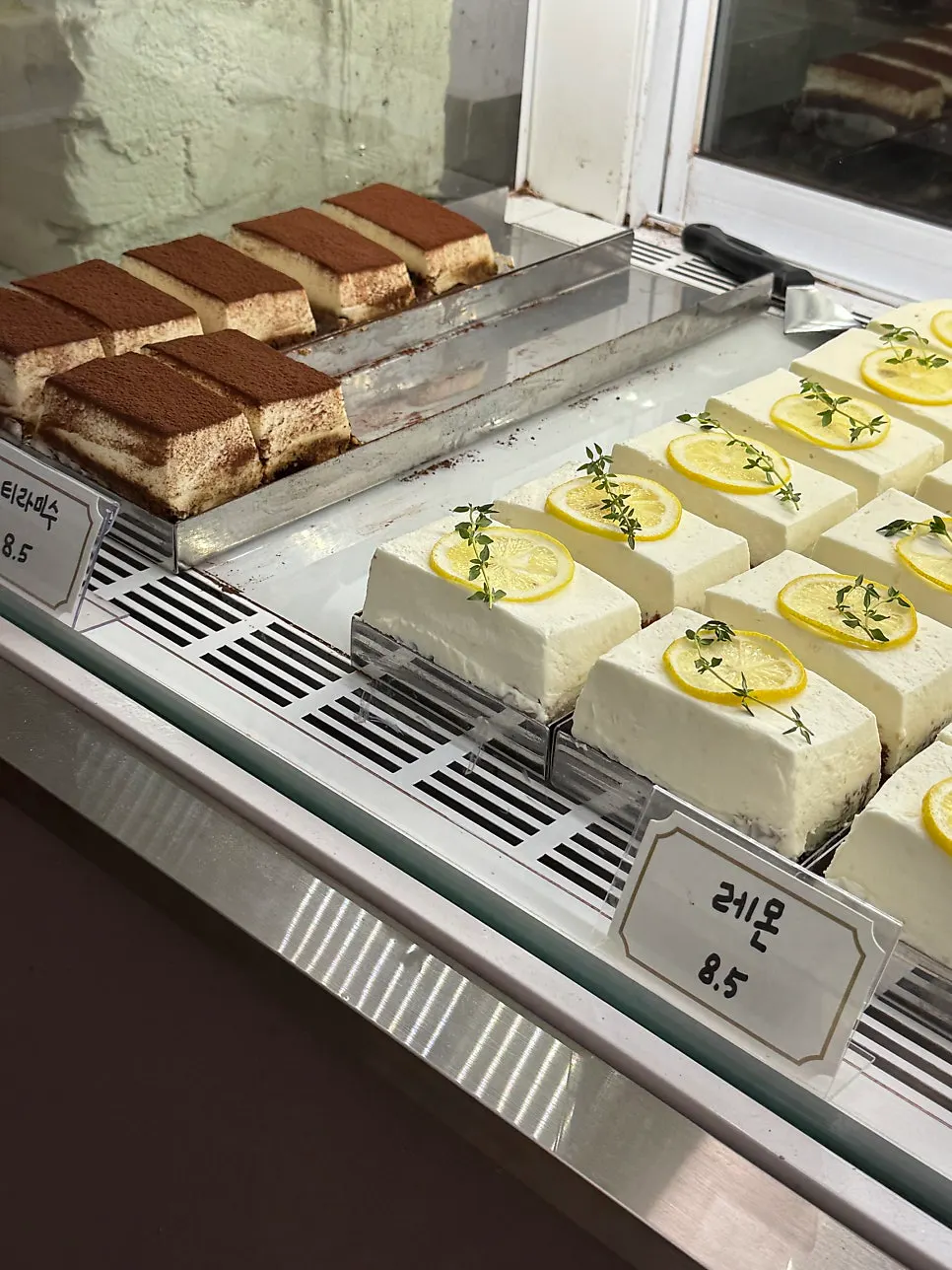 Slice cakes arranged in the display case