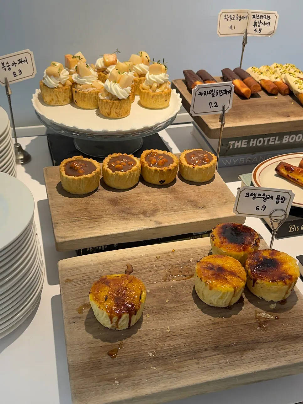Caramel cheese pie and peach pie on display