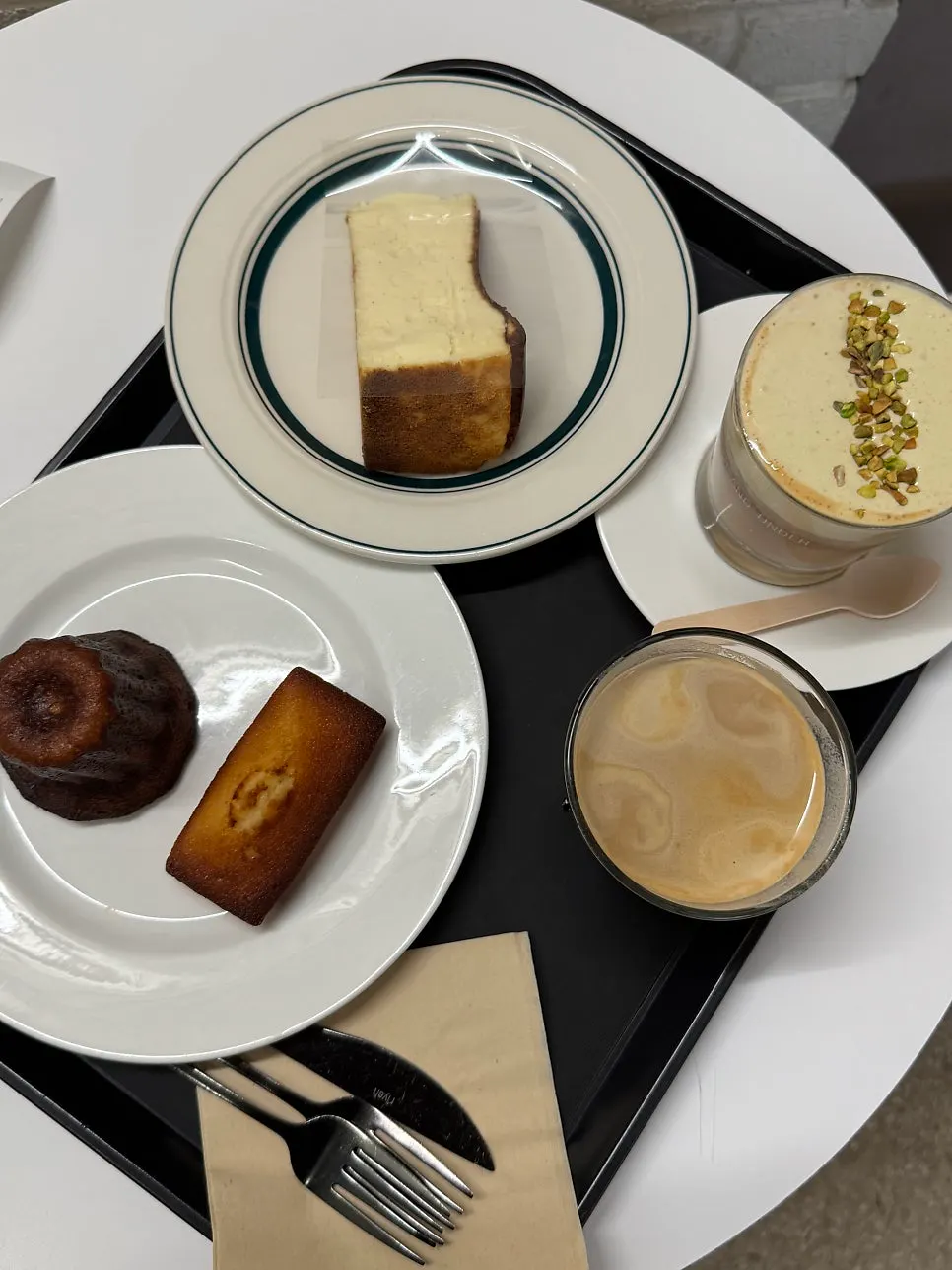 Cream latte and baked snacks on the table