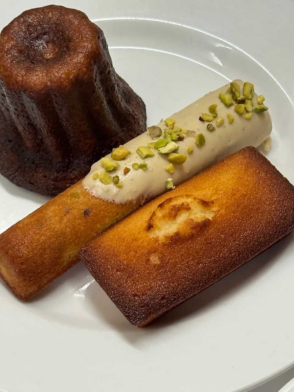 Canelé and financier on a plate
