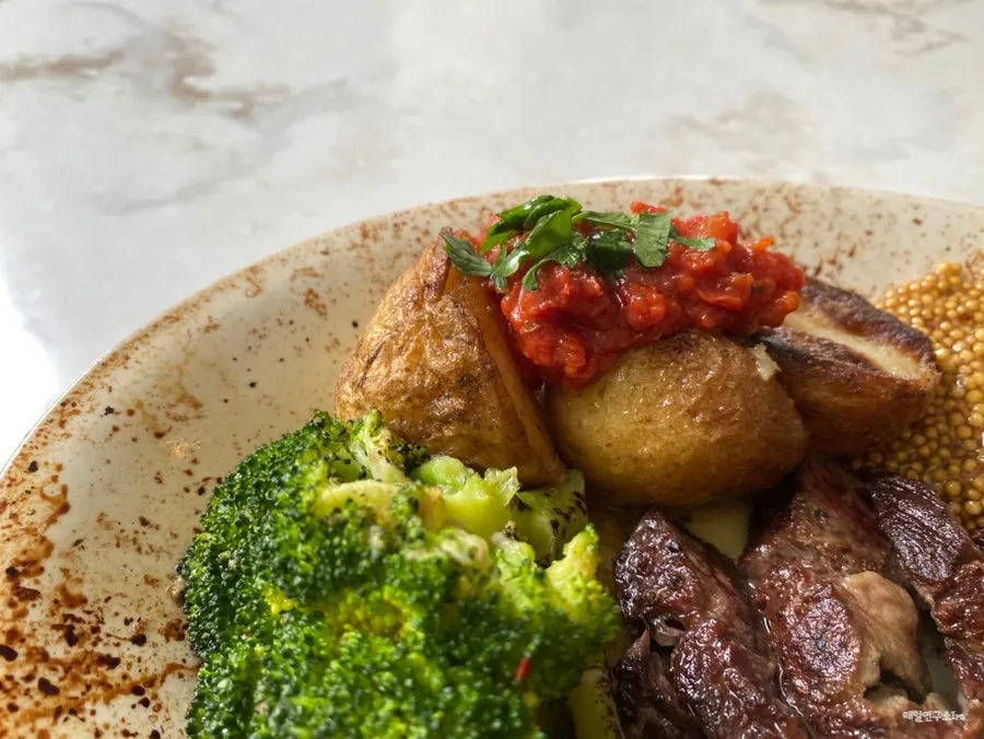 Close-up of the plate showing the steak's doneness