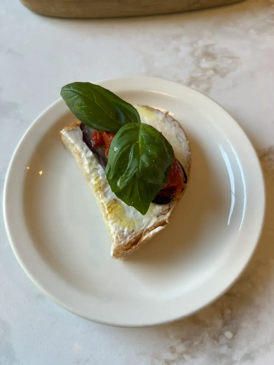 Close-up of bruschetta finished with basil