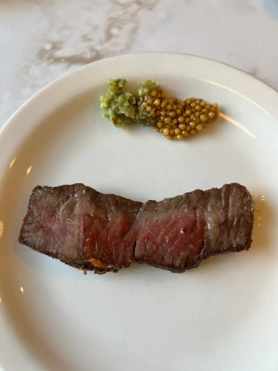 Whole grain mustard sauce served with the steak