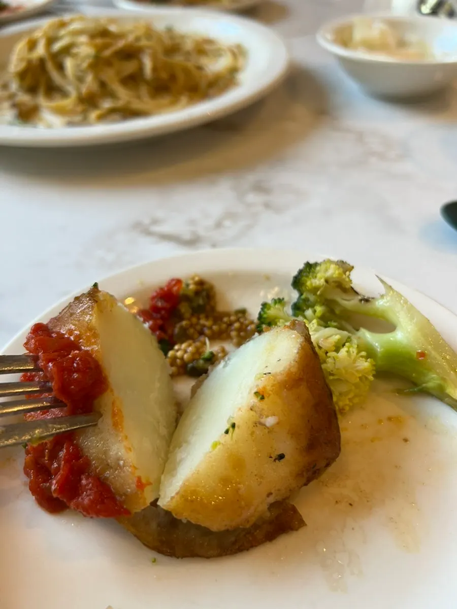 Potatoes roasted in duck fat with tomato sauce