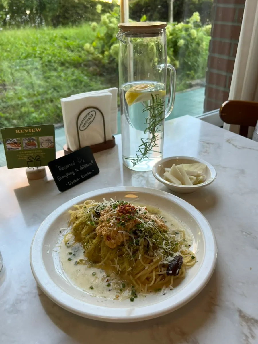 A plate of sea urchin pasta at Upstairs Kitchen
