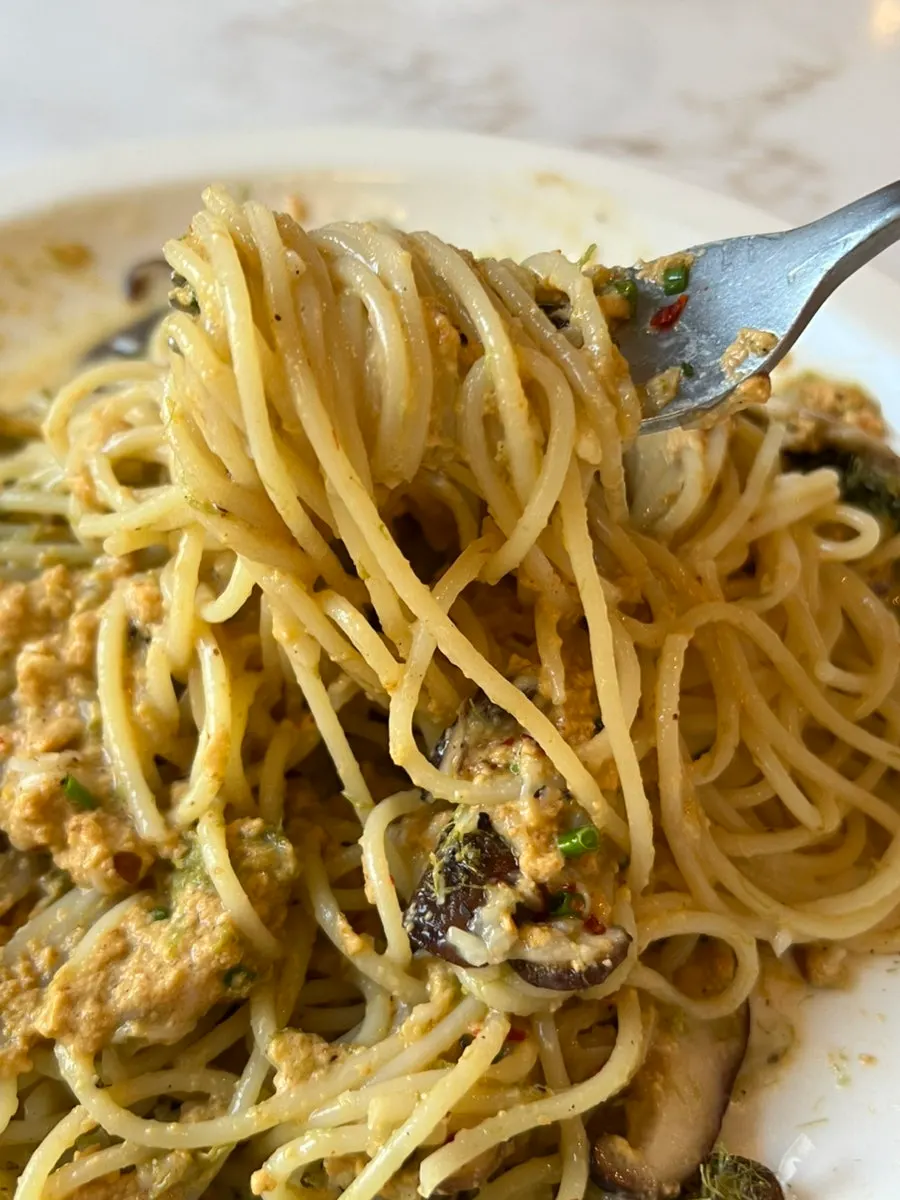 Close-up of pasta mixed with sea urchin sauce