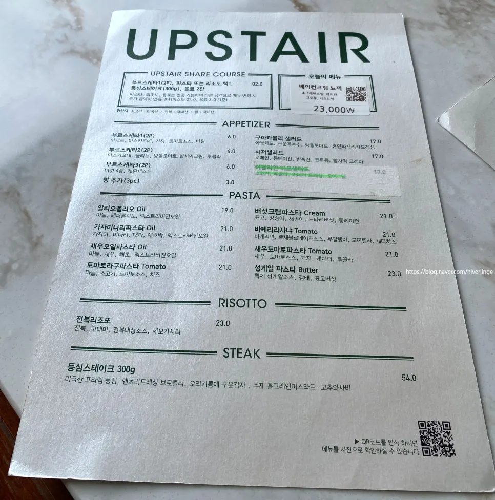 Pasta and steak menu board at Upstairs Kitchen