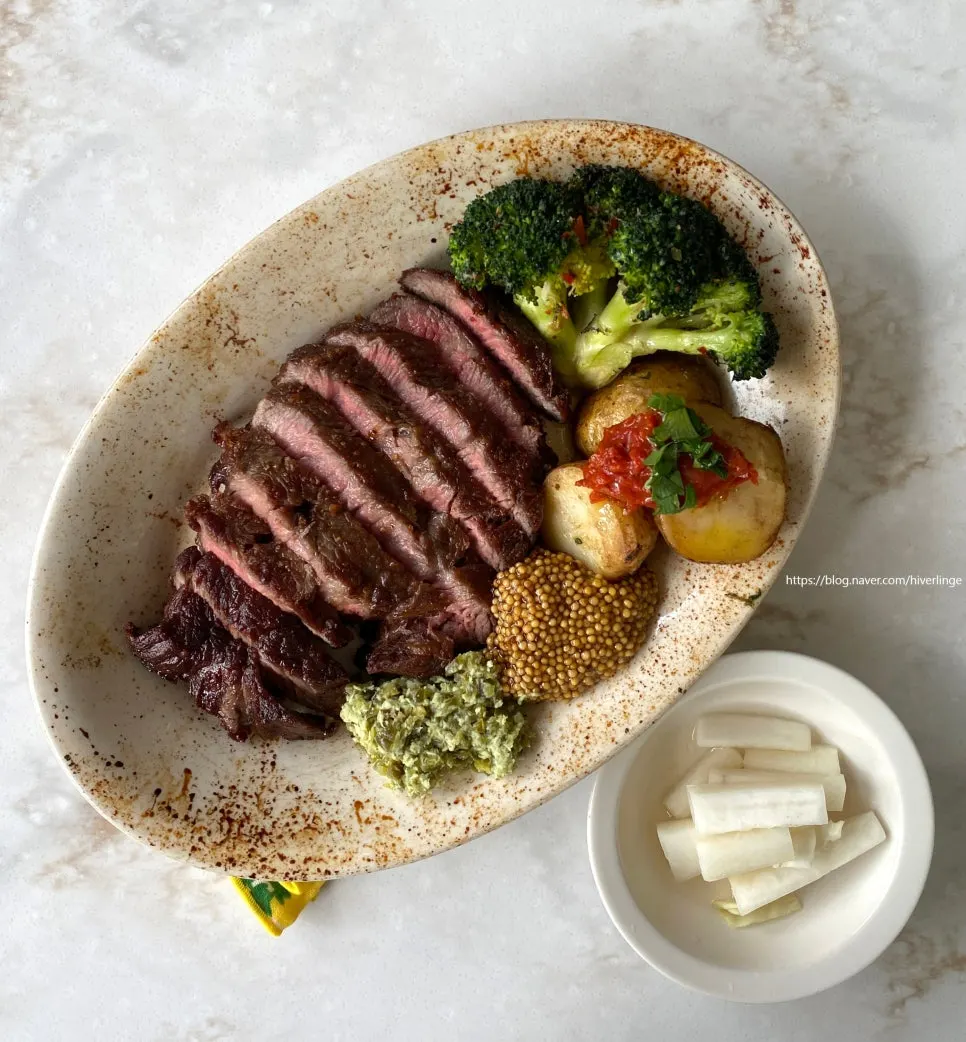 Plated 300g sirloin steak at Upstairs Kitchen