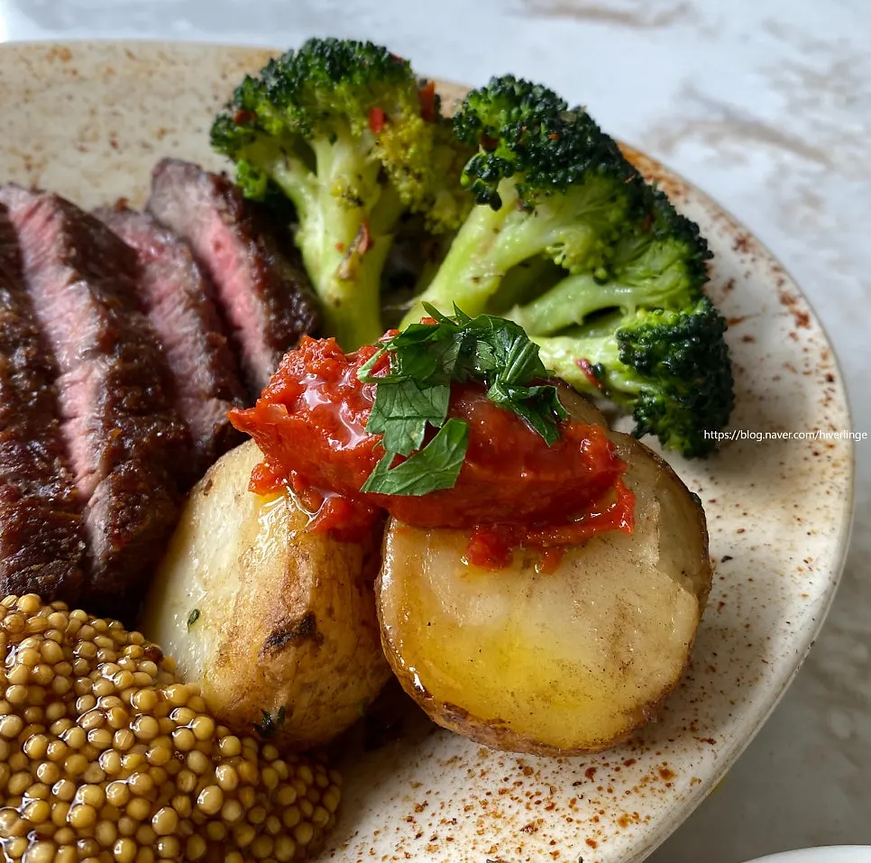 Sirloin steak served with baby potato garnish