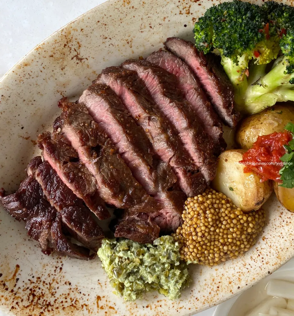 A piece of steak with jalapeño wasabi sauce