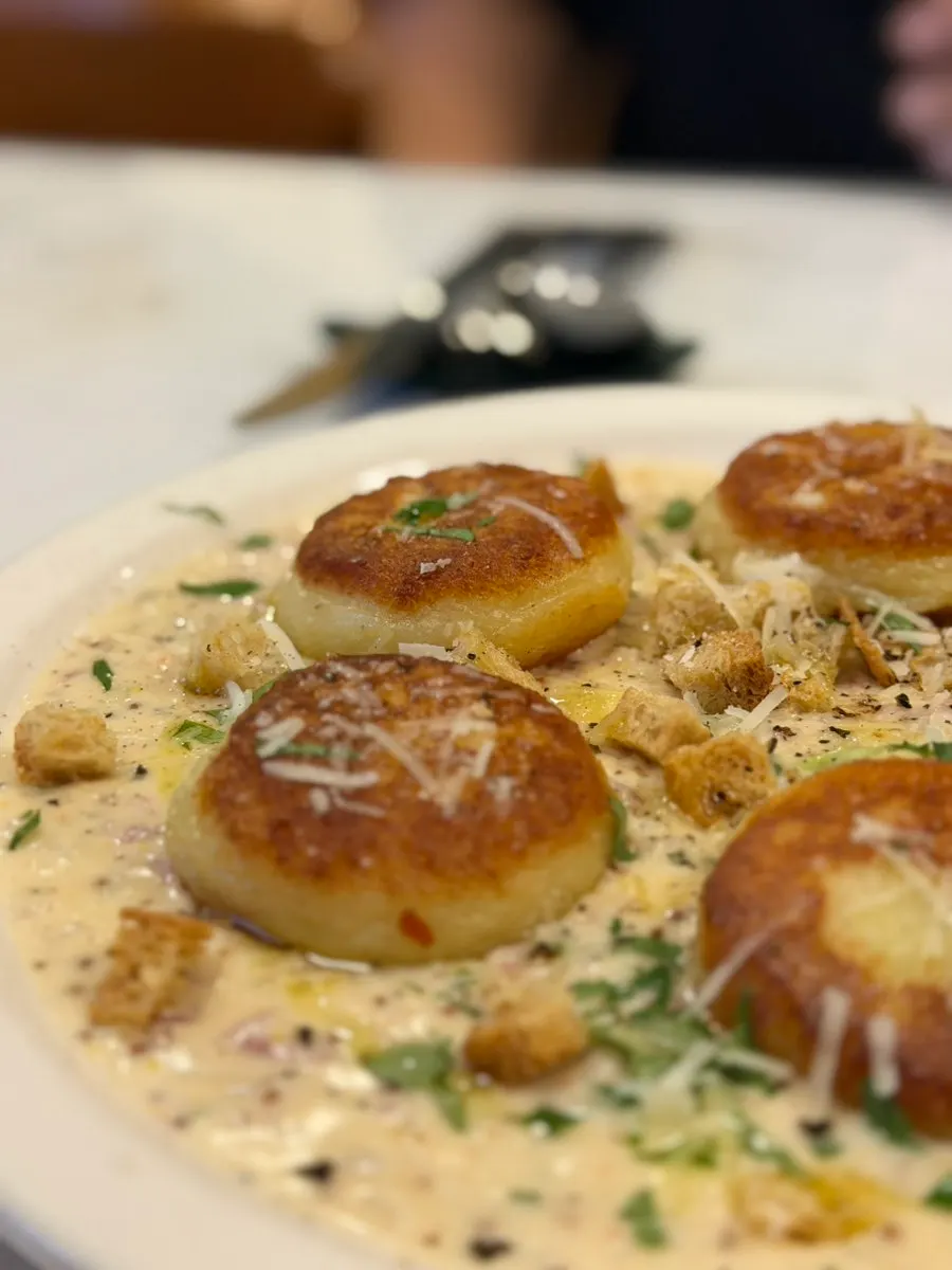 Round, flat gnocchi browned nicely