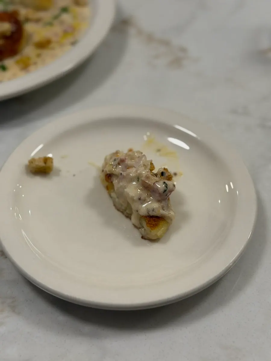 Cream gnocchi served with bacon