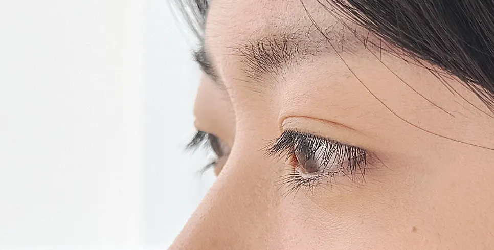 Straight lashes drooping downward before treatment