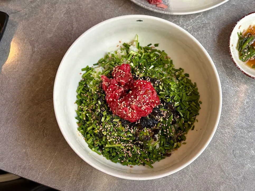 Broth and seaweed served alongside the yukhoe bibimbap