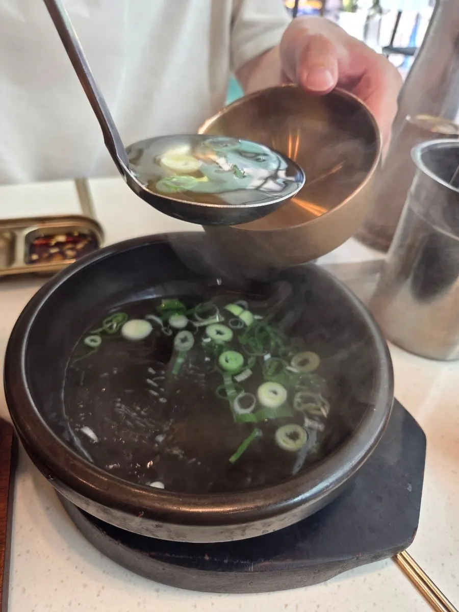 A bowl of warm meat broth