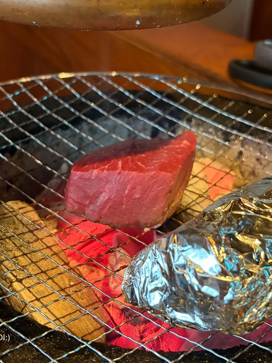 Ox tongue grilling on the fire