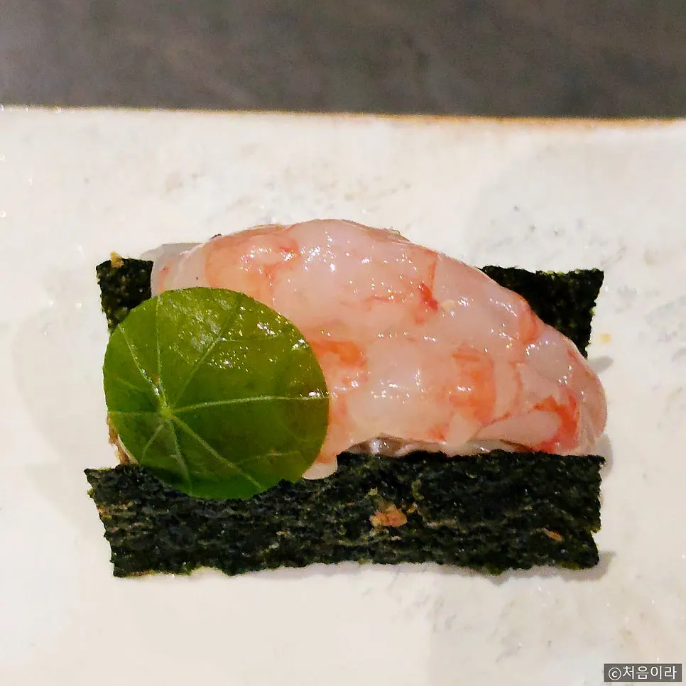 Lobster taco made with squid ink taco shell and sous vide lobster