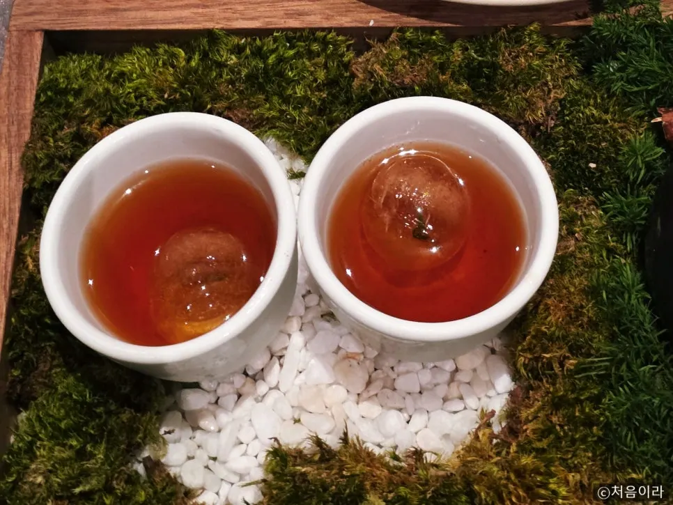 Jasmine tea served with a single ice cube