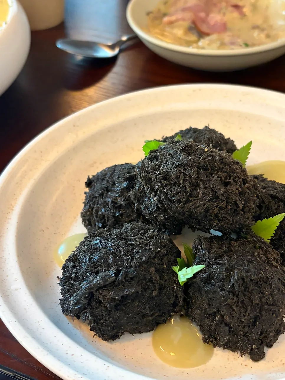 A plate of Usul's shiitake ink fritters