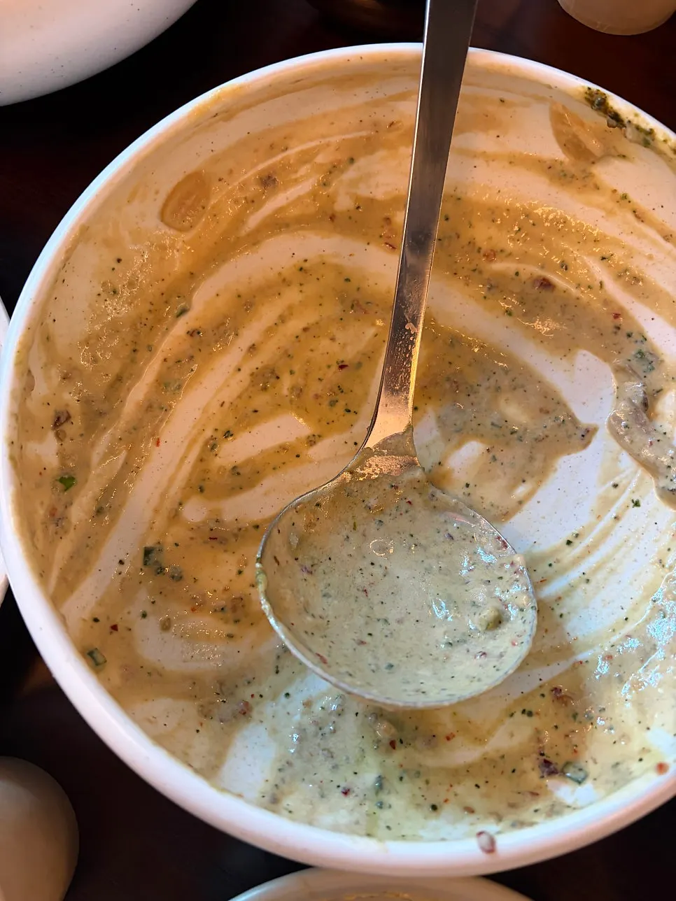 A spoonful of sujebi in cream sauce