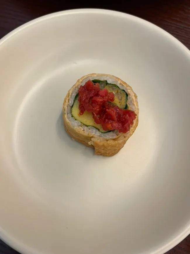 Plating of gochujang yukhoe with yubu rolls