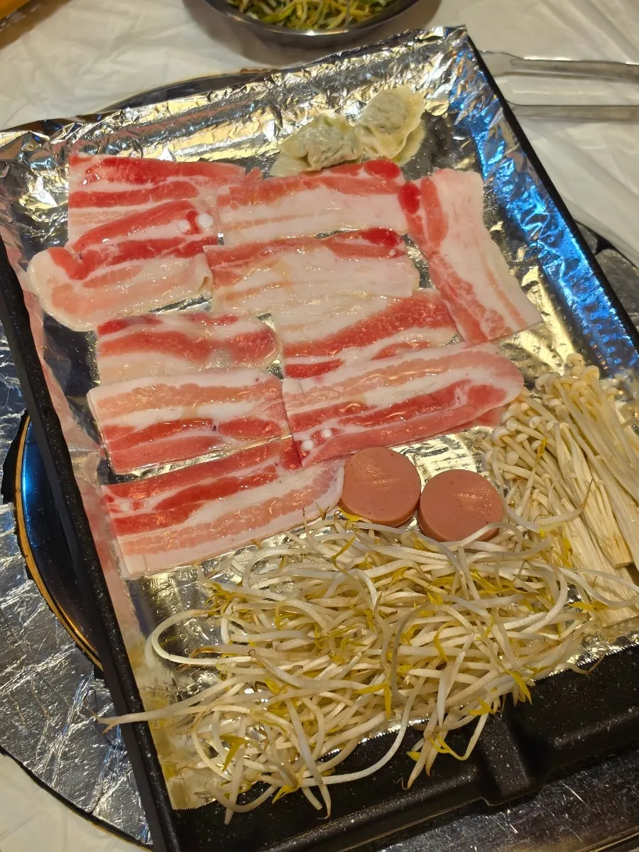 Three servings of frozen pork belly dipped in special shio-yaki sauce