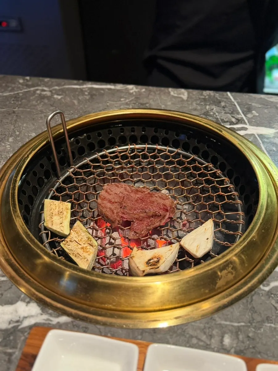 Close-up of staff grilling saeusal