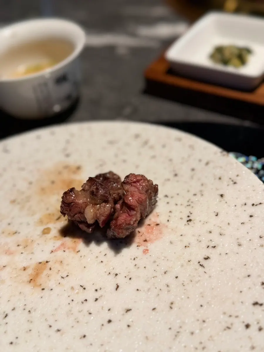 A piece of mitganssal eaten with sauce