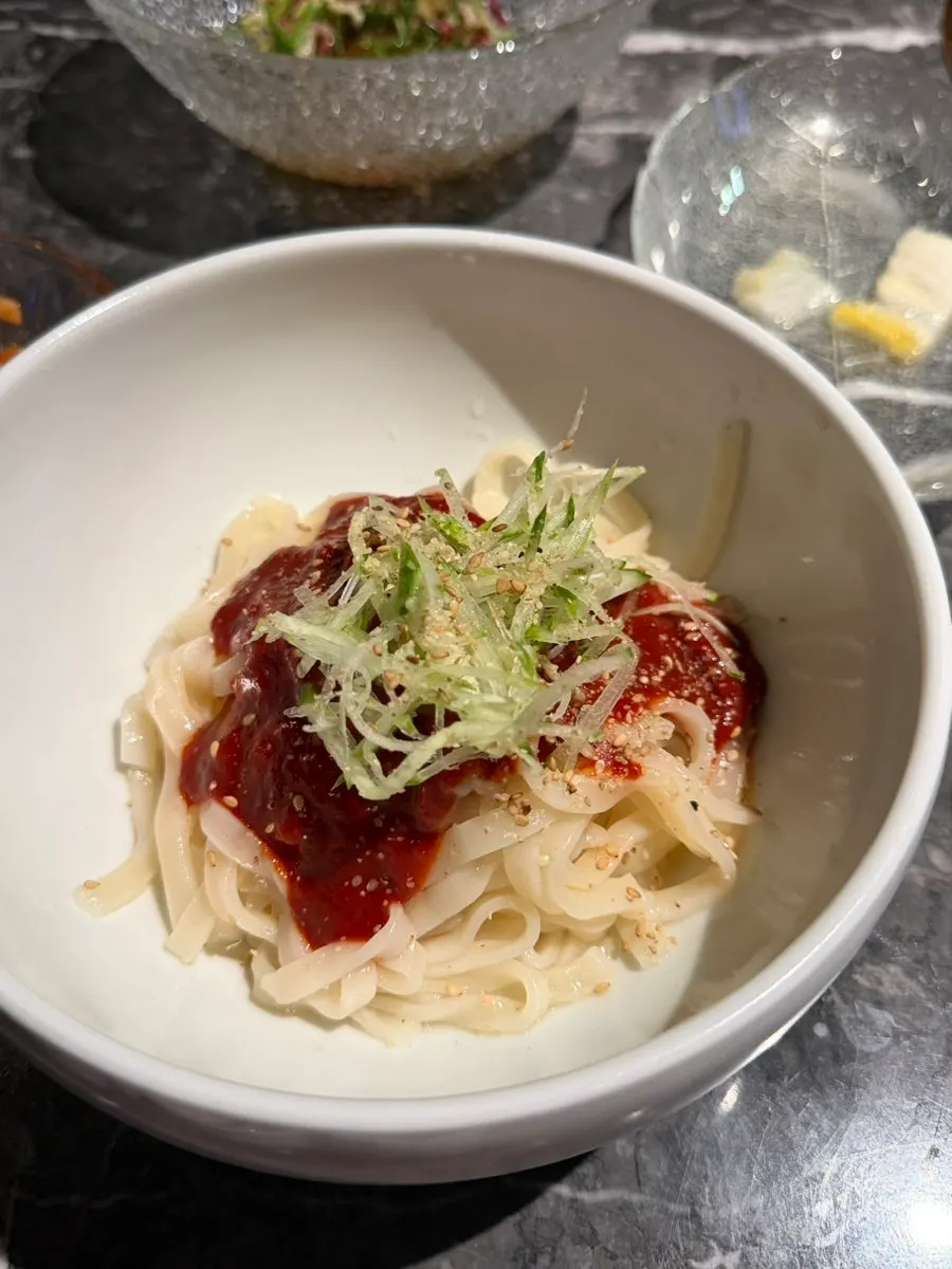 Spicy bibim guksu served to finish the meal