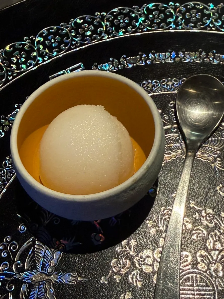 Pear dessert opened to reveal sherbet inside