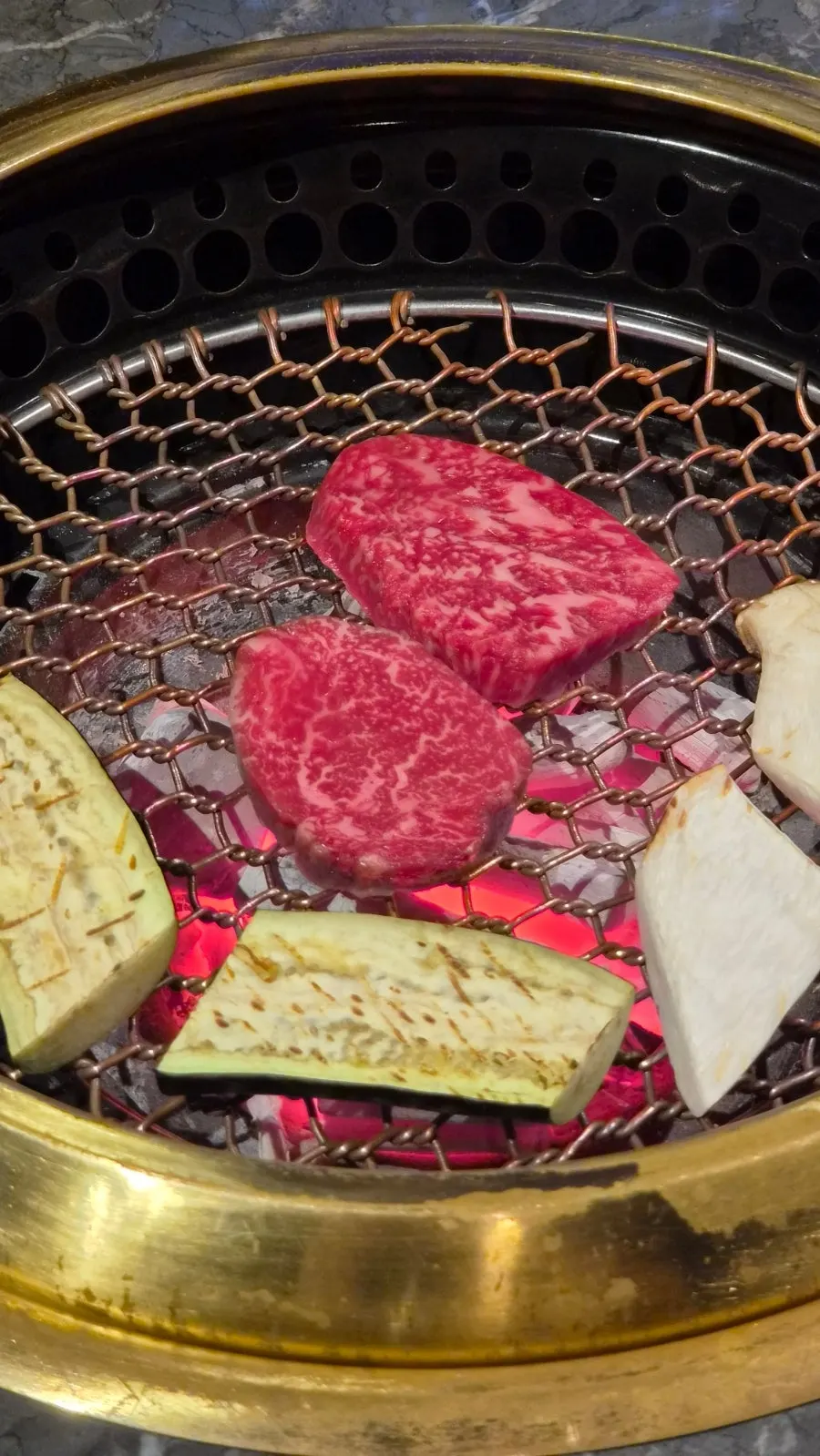 Hanwoo sirloin grilling on the tabletop grill