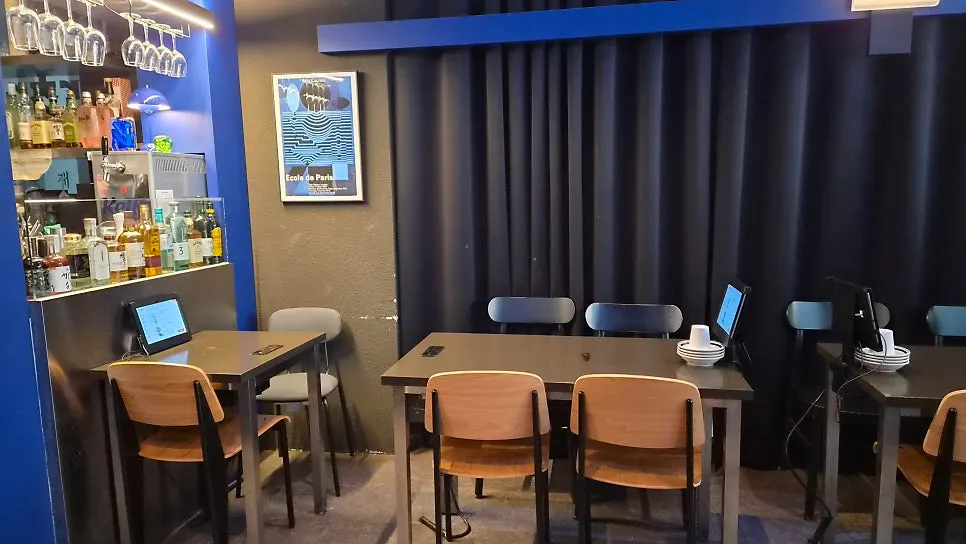 Interior of Bacha Pangyo Branch with black and deep blue accents