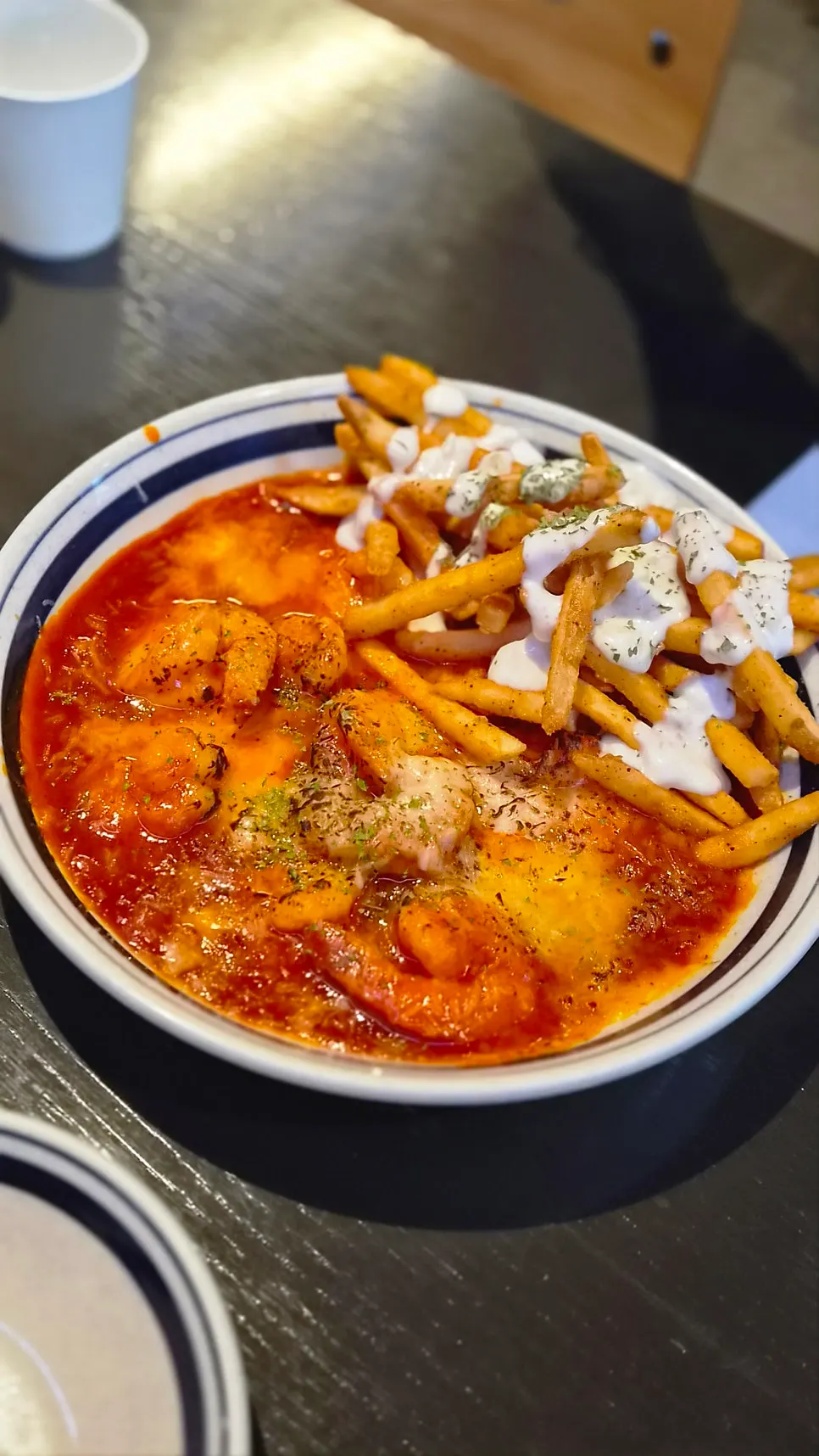 Chili shrimp topped with mozzarella cheese and fries