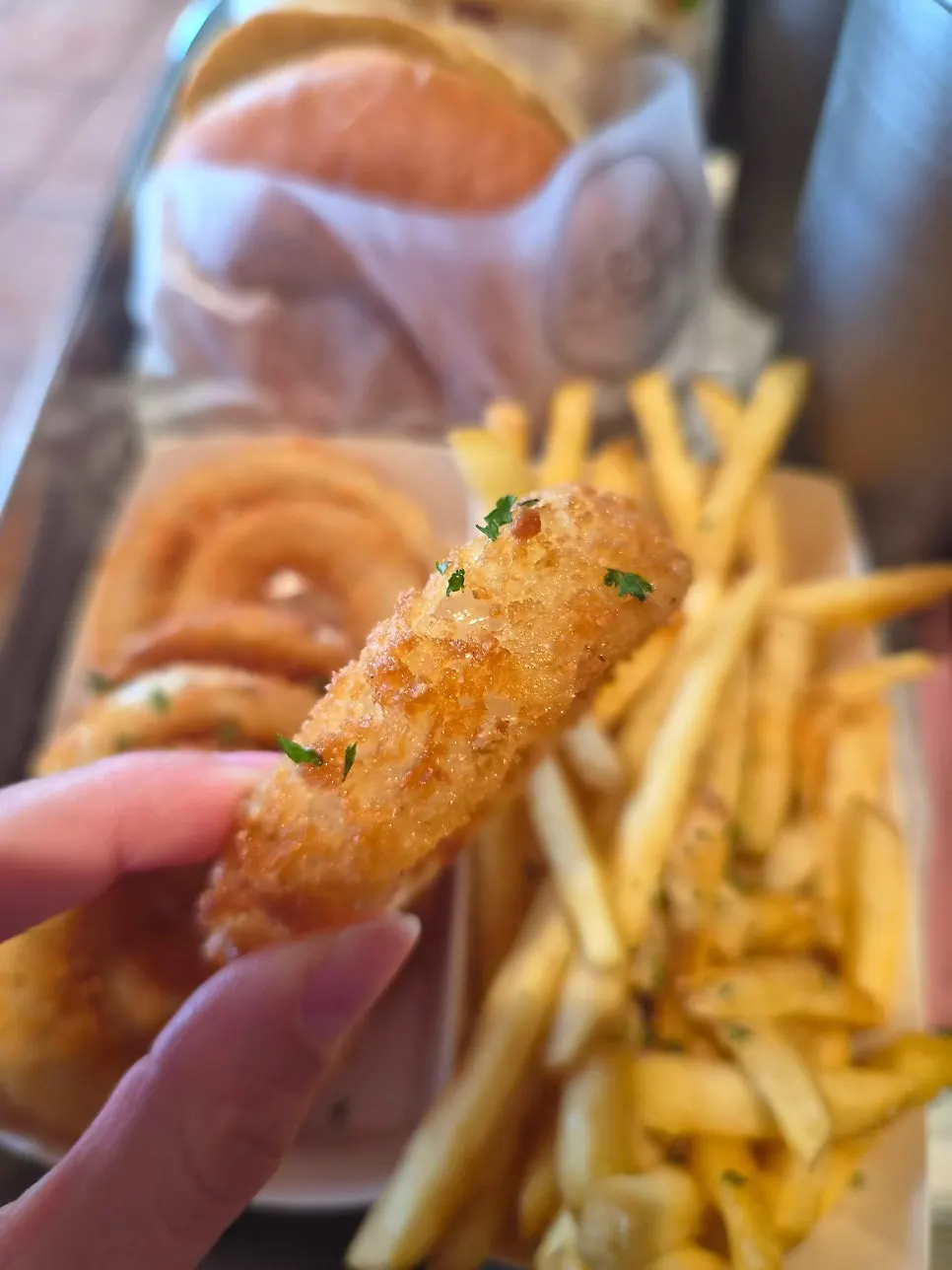 Freshly fried onion rings and French fries