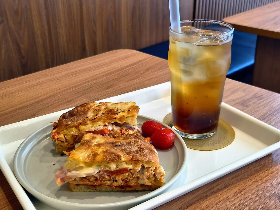 BBQ chicken grill sandwich served with marinated tomato