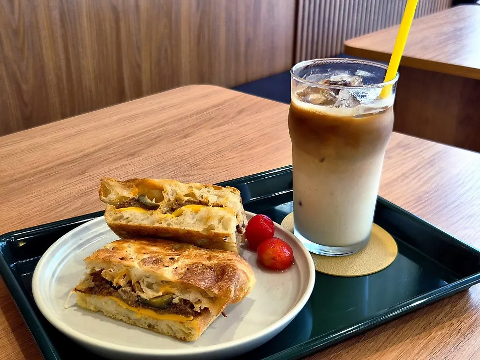 Plate with Benetto's BBQ chicken grill sandwich