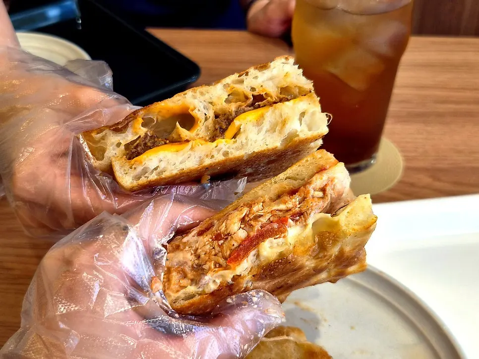 Two types of Benetto sandwiches shared between two people