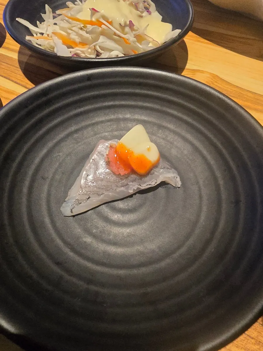 Rockfish sashimi served with wrapping vegetables