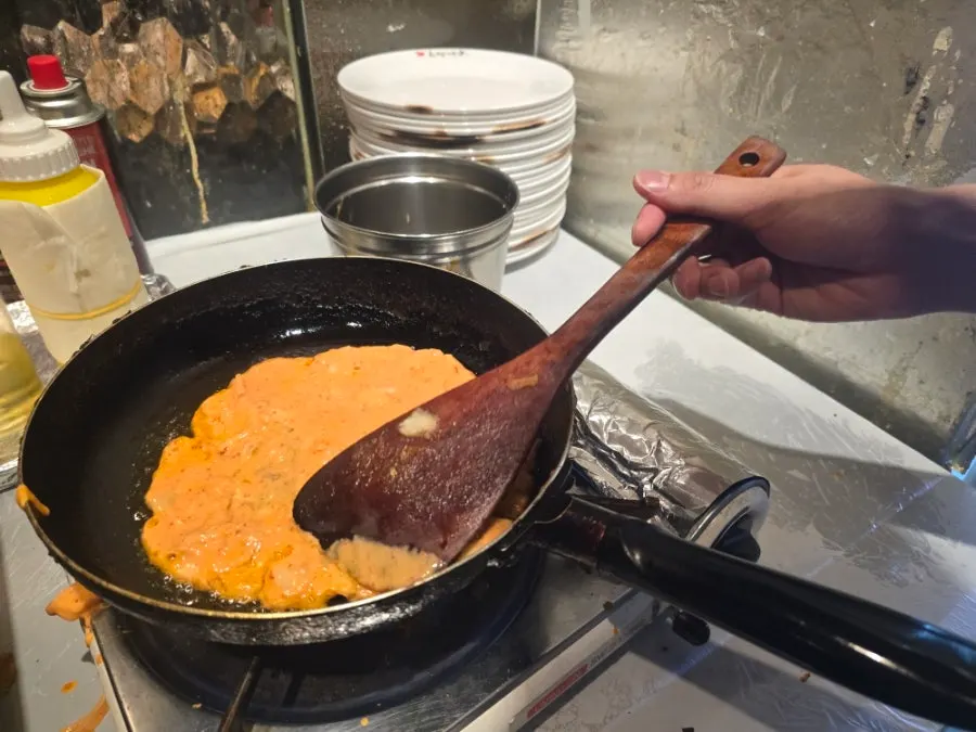 Preparing to make a self-cooked pancake at the table