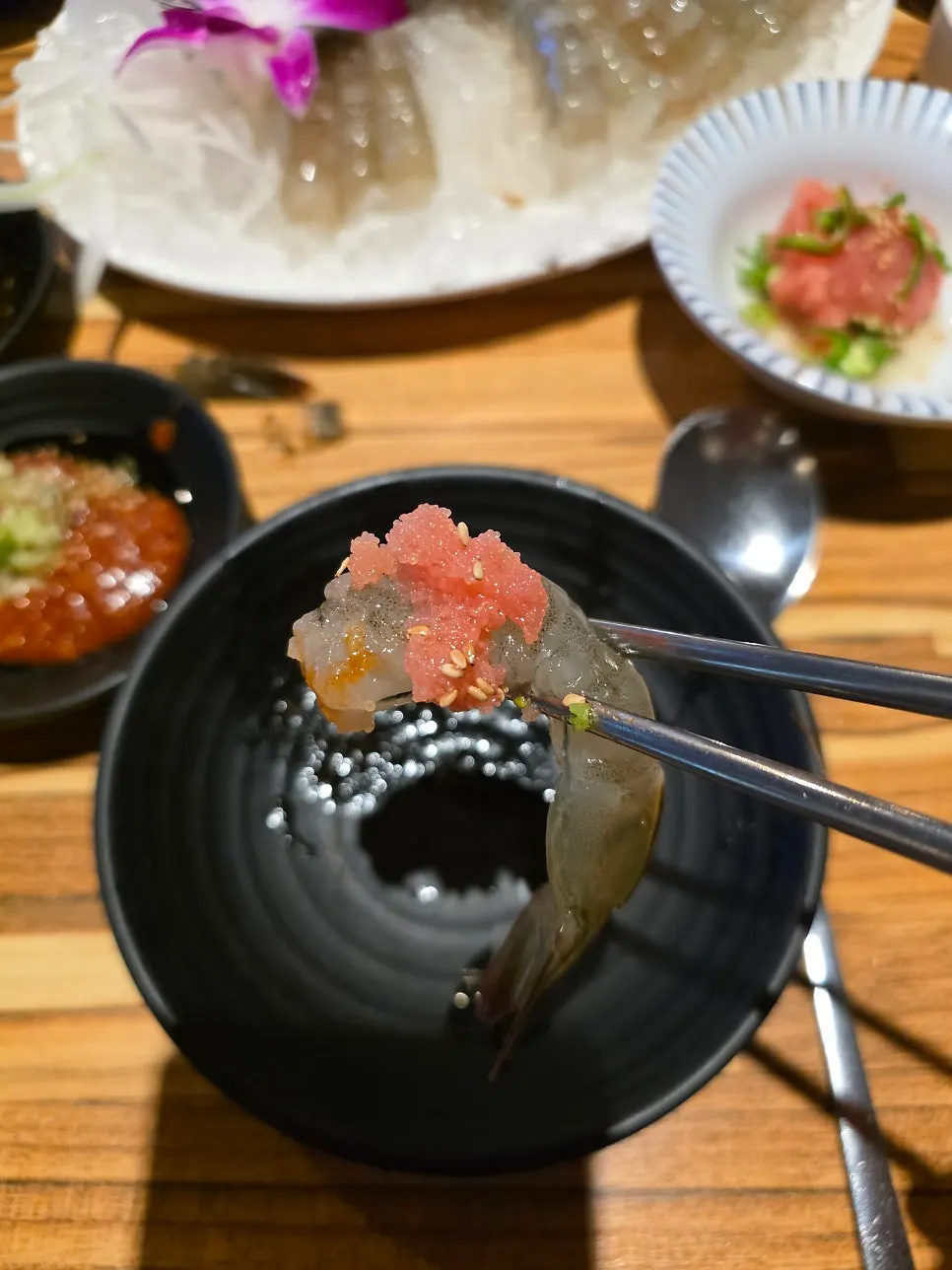 A plump piece of raw shrimp sashimi