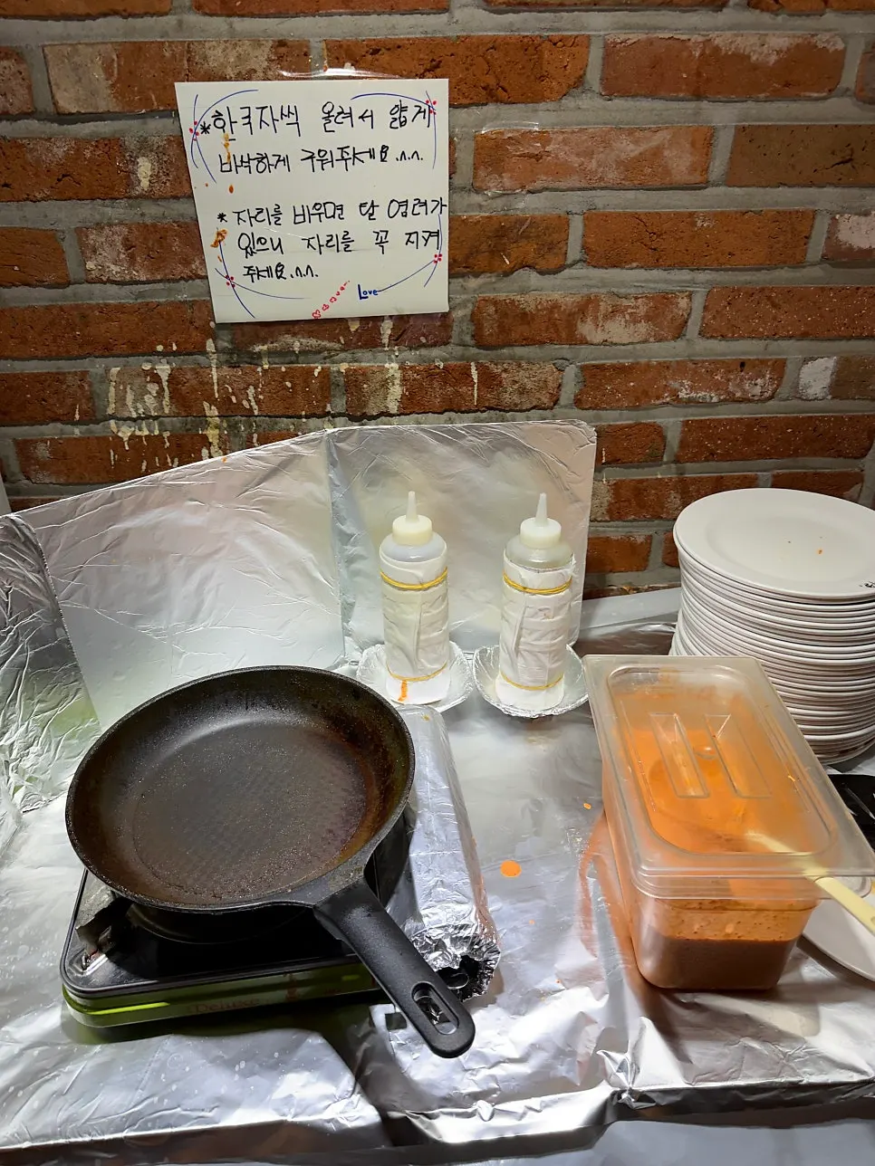 White kimchi and warm seaweed soup at the self-serve bar