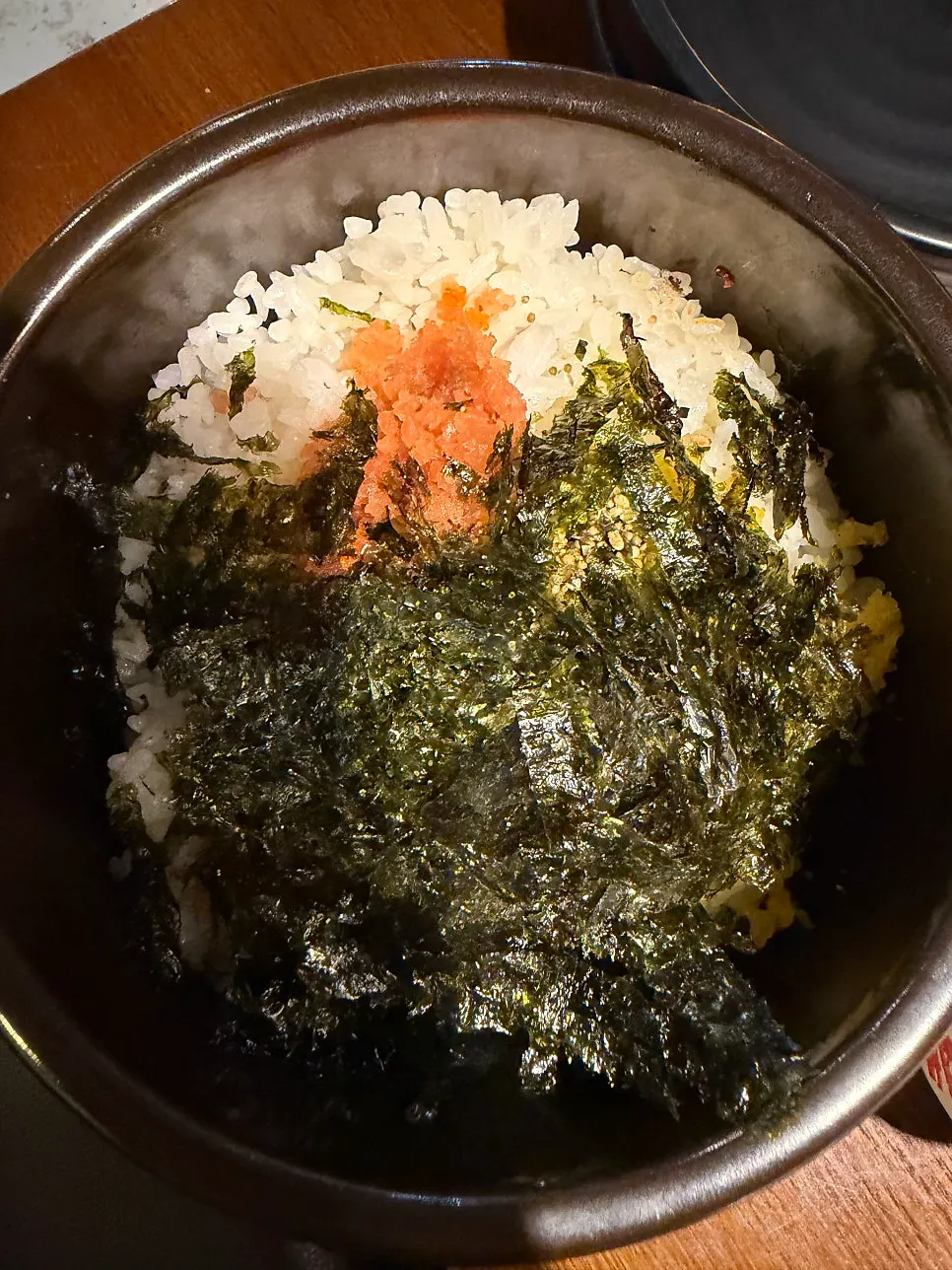 Hotpot rice mixed together with a spoon