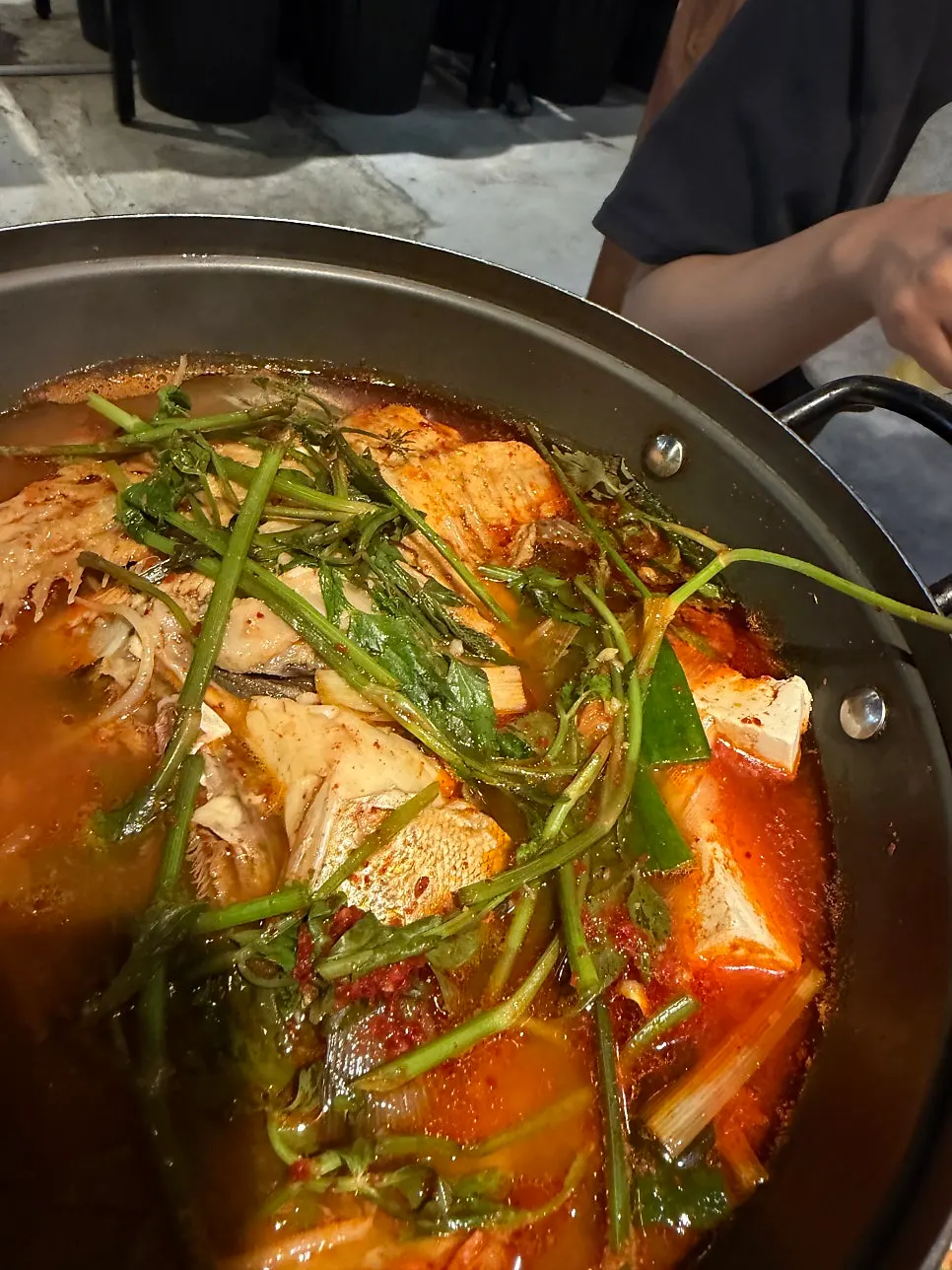 The bubbling stew broth with vegetables